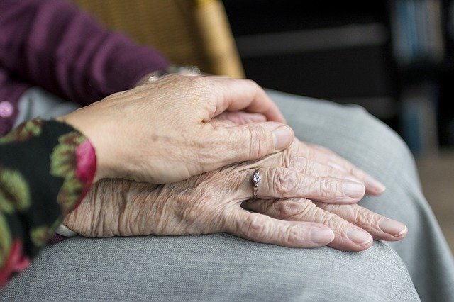 Pensioner's hands on their lap