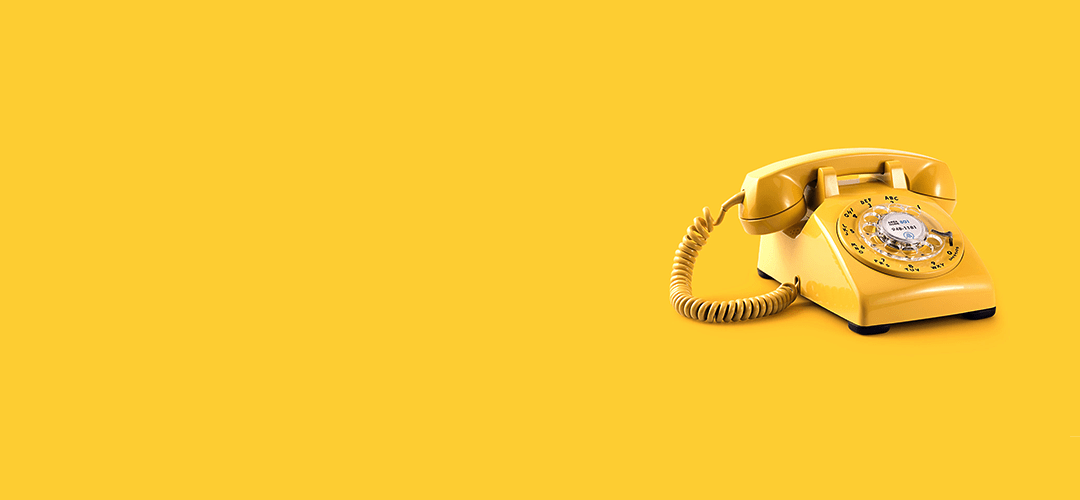 Yellow rotary-style telephone